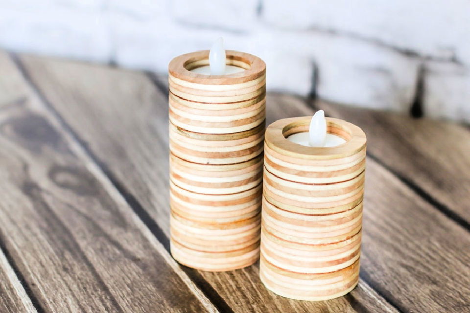 Give plain pillar candles a beachy look with sand and seashells