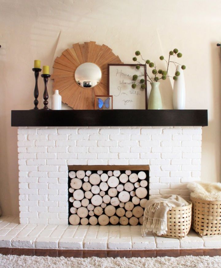 Make Your Own Faux Log Stack Fireplace Screen